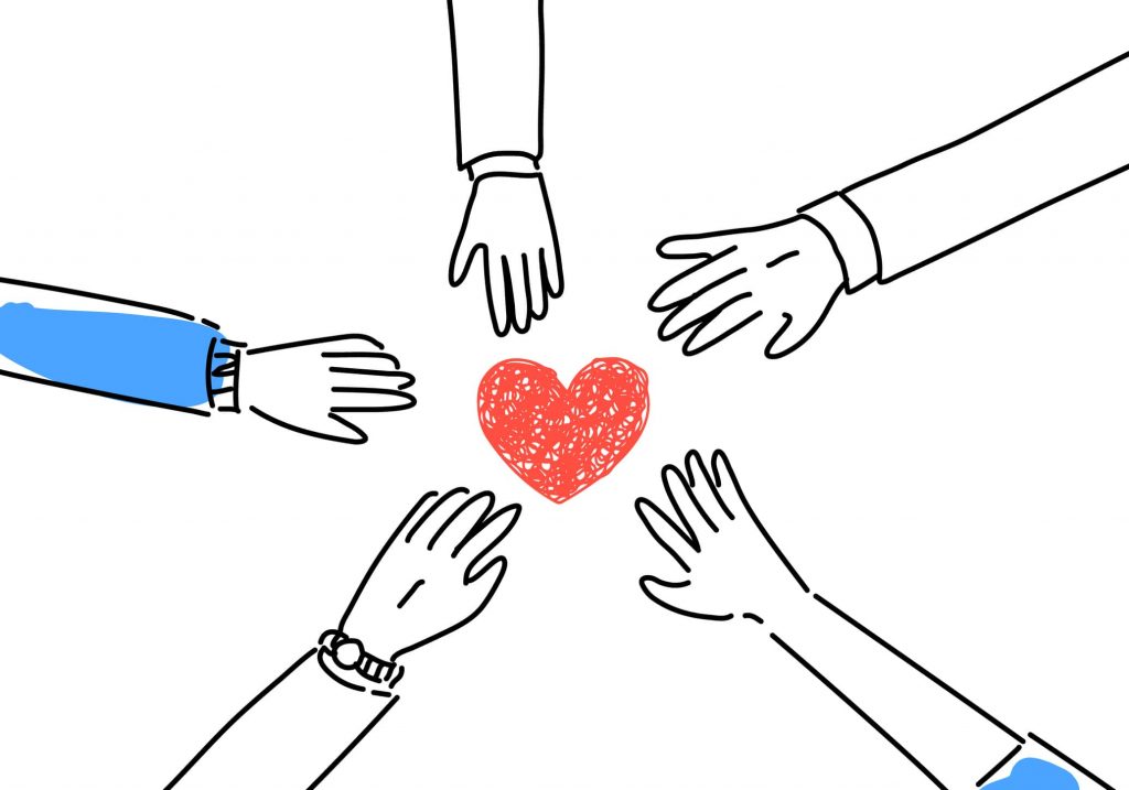 Hands outstretched around a heart
