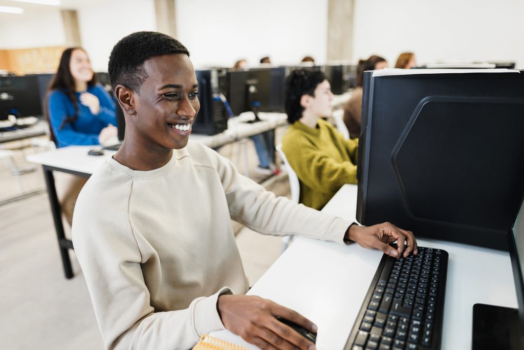 Person smiling while using computer